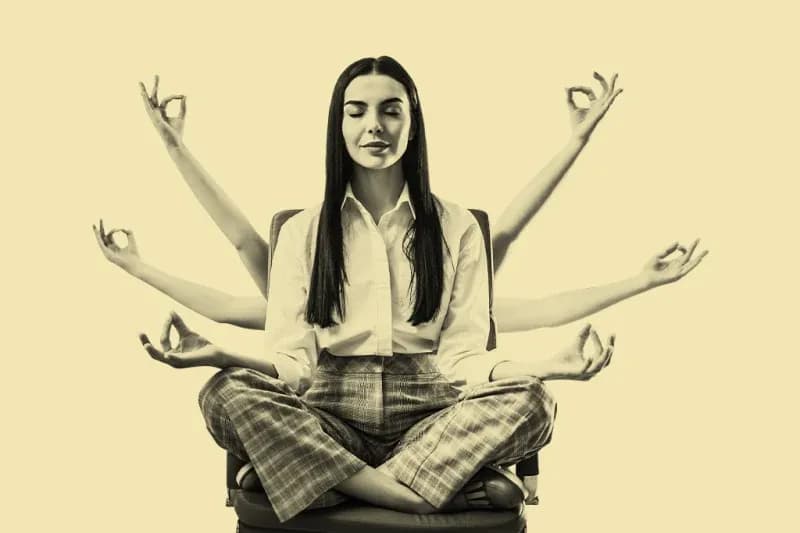 A person with numerous hands meditating